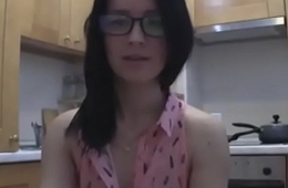 splendid teen with glasses chatting in make an issue of kitchen